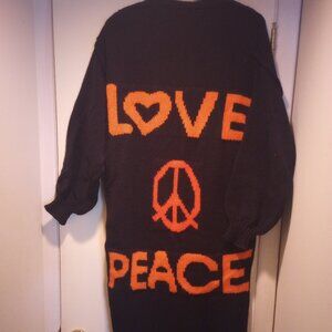 Love peace in orange oversized long blk sweater size M  100% poly New In bag!